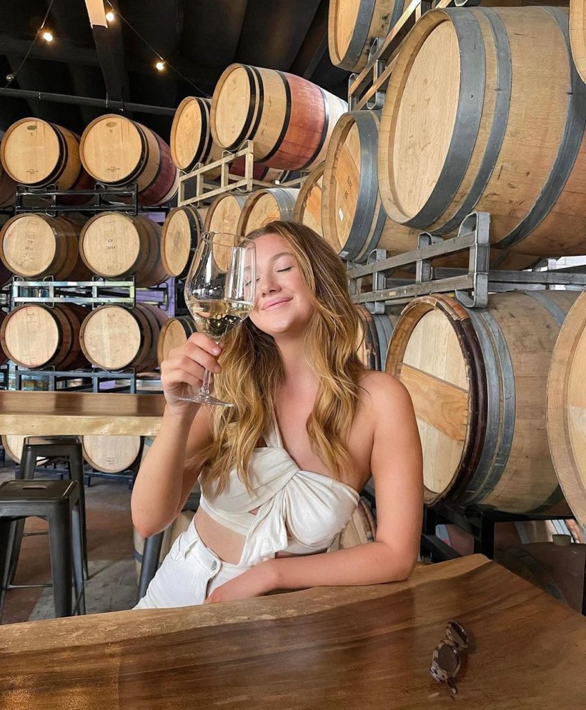 Girl enjoying a glass of Wine at Carruth Cellars In San Diego