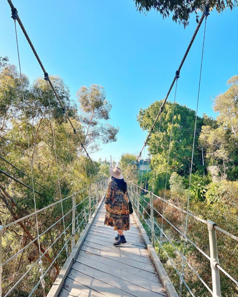 Girl on suspension bridge