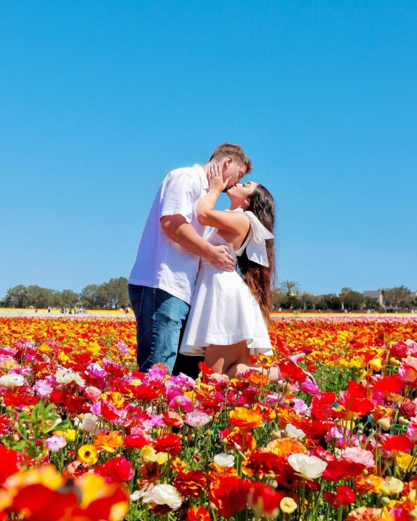 Couple kissing at Carlsbad Flower Fields