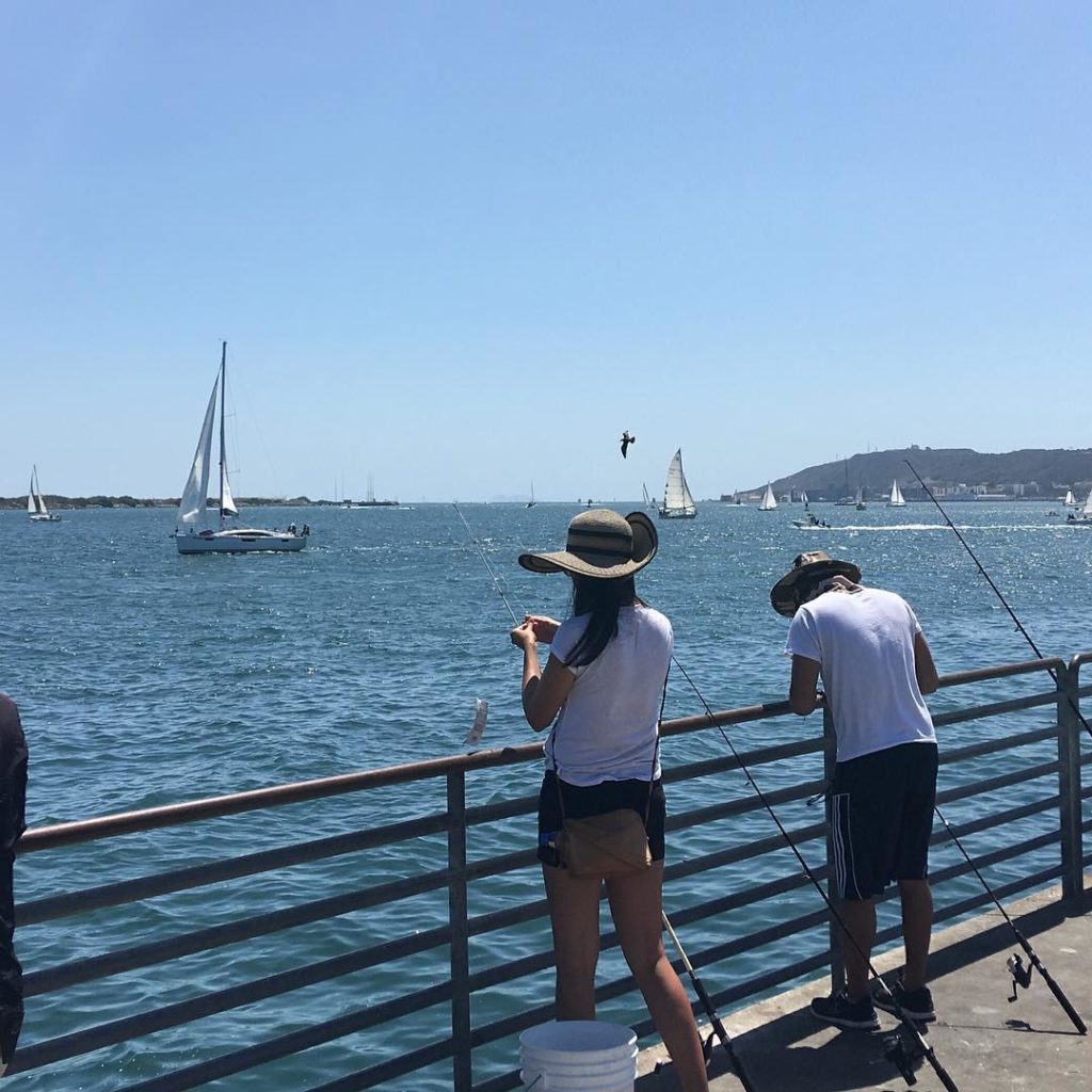 People fishing off pier