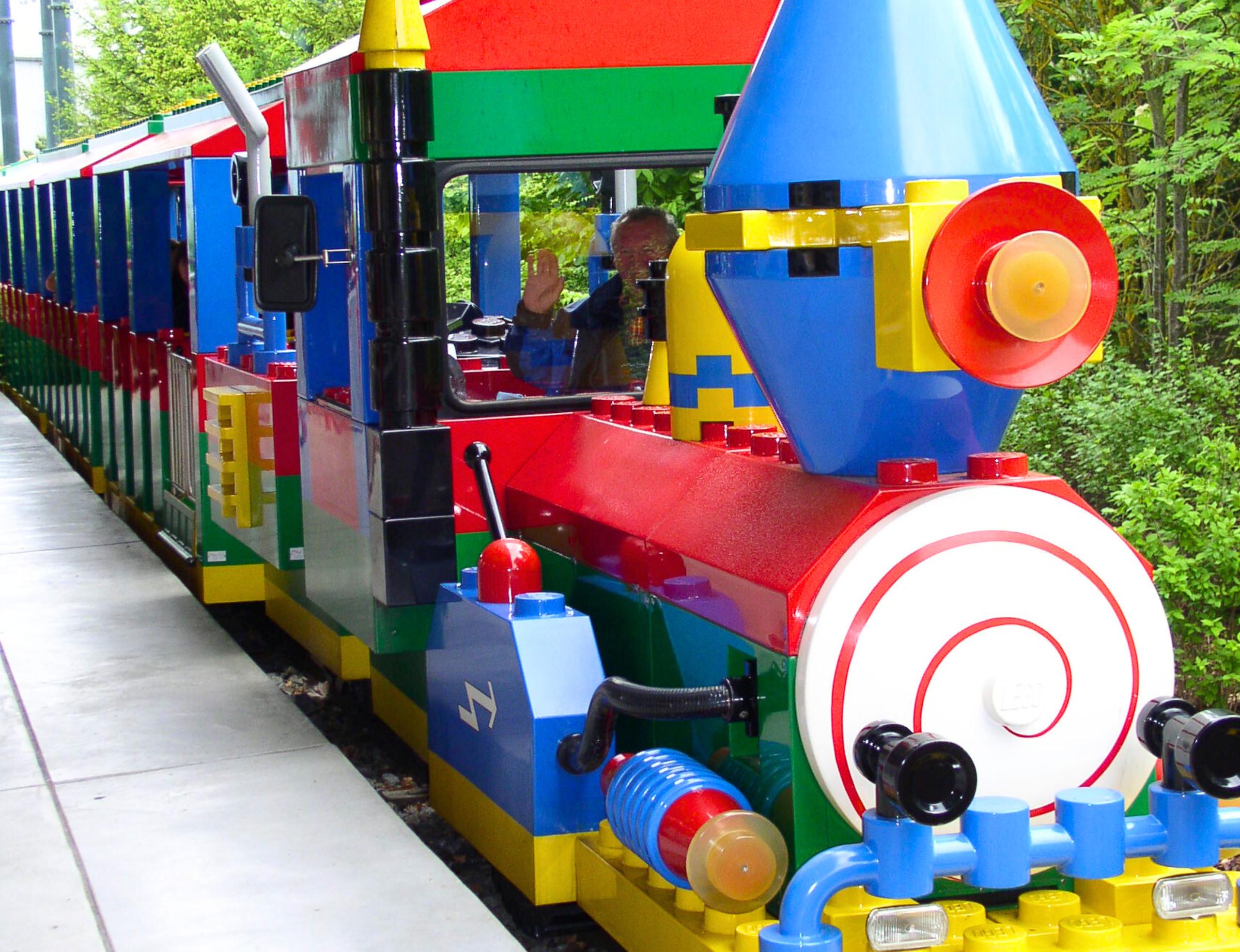 Legoland train with an elderly man waving
