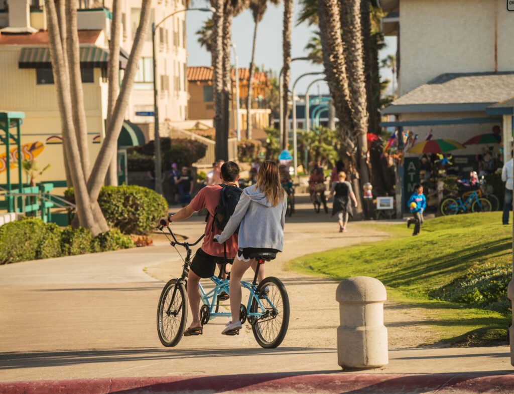 Couple riding a duo bicycle