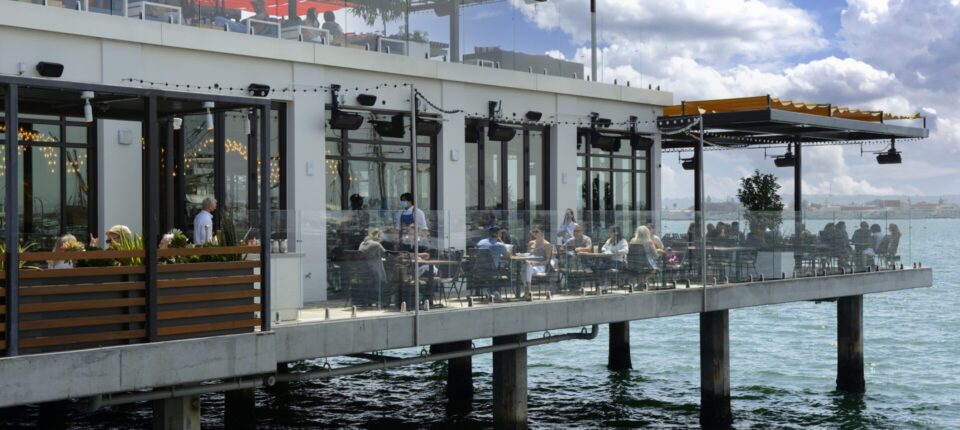 a restaurant on a pier over the water