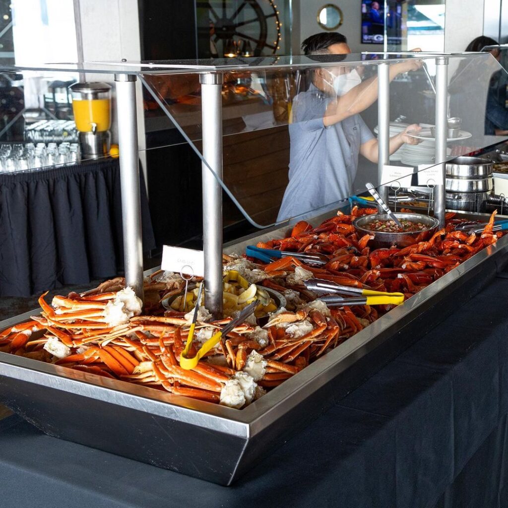 a seafood buffet with crab legs and lobster tails