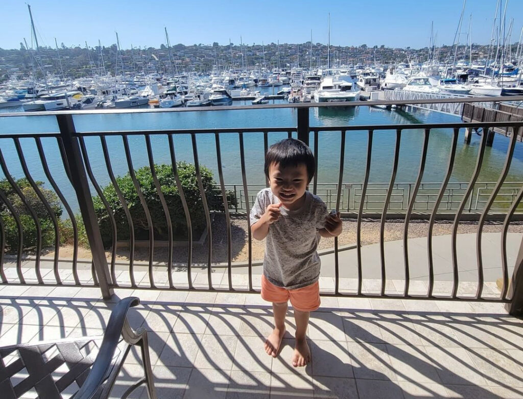 girl standing in front of marina