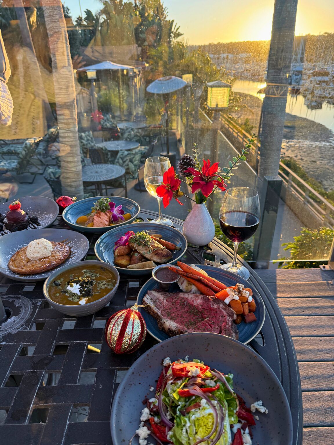 Christmas Dinner at table in front of marina