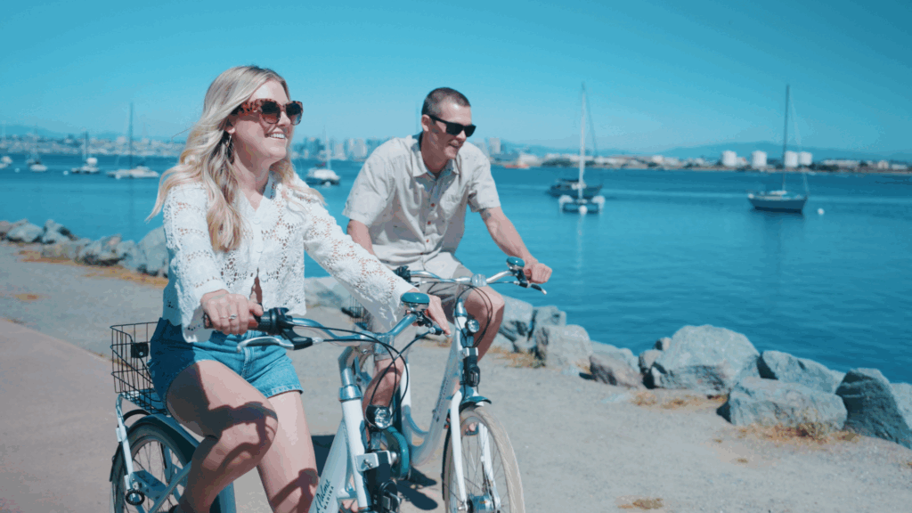 Two guests enjoying bike riding next to shelter island