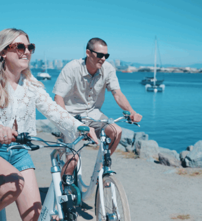 Two guests enjoying bike riding next to shelter island