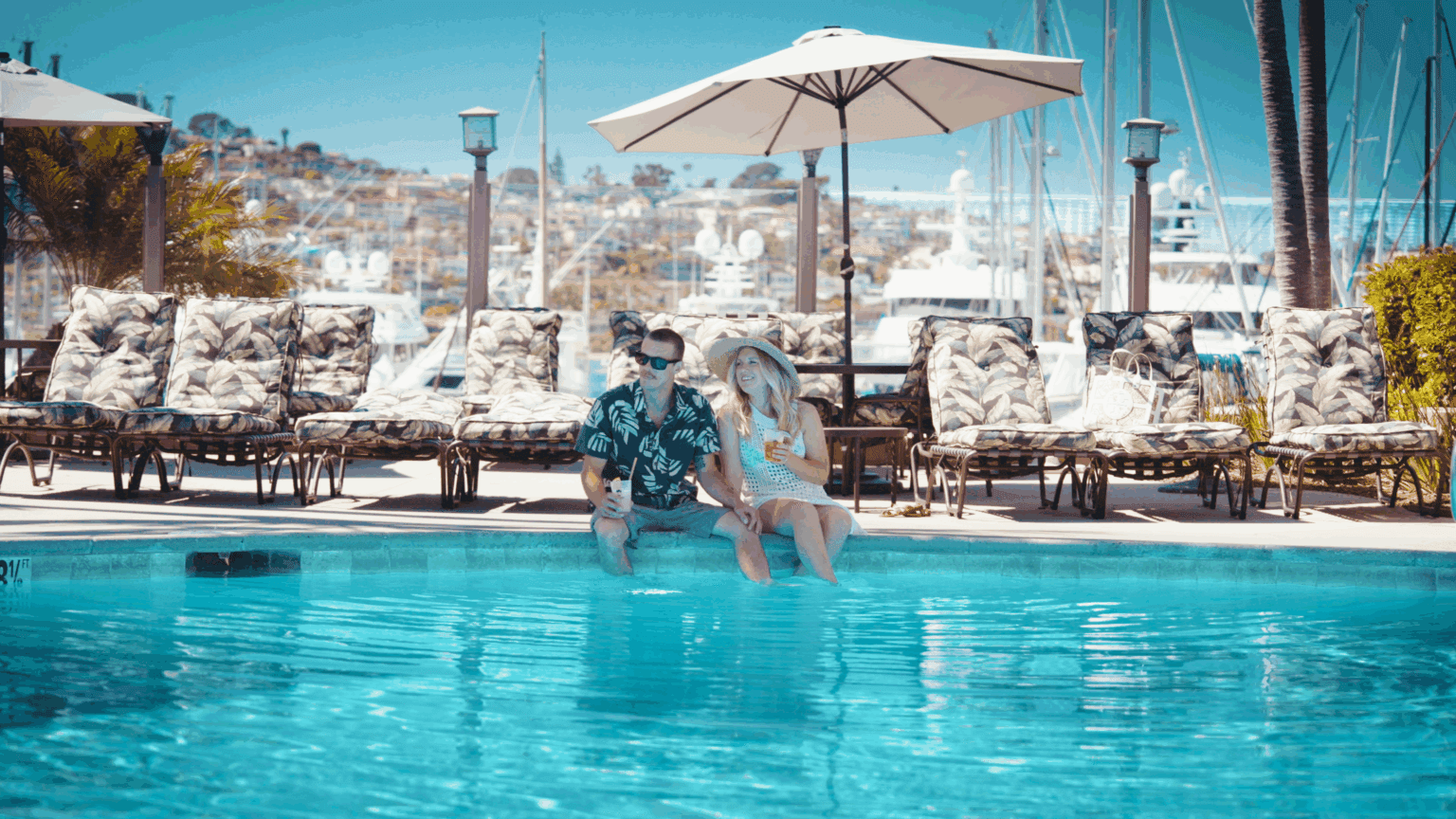 Guests enjoying drinks by the pool
