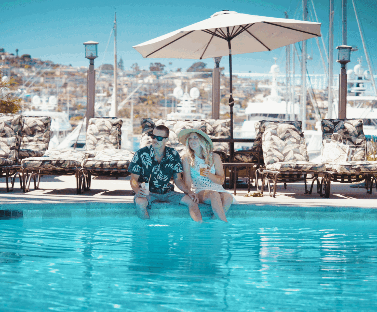 Guests enjoying drinks by the pool
