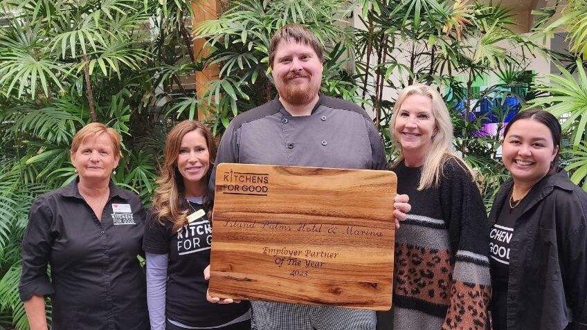 island palms team in front of fountain