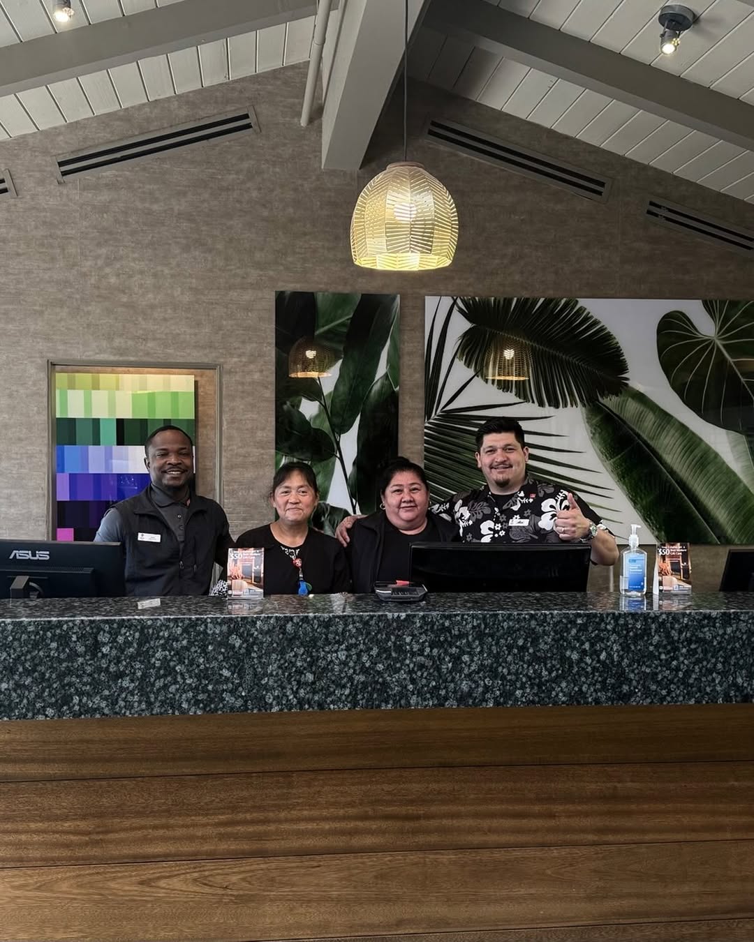 island palms team in front of front desk