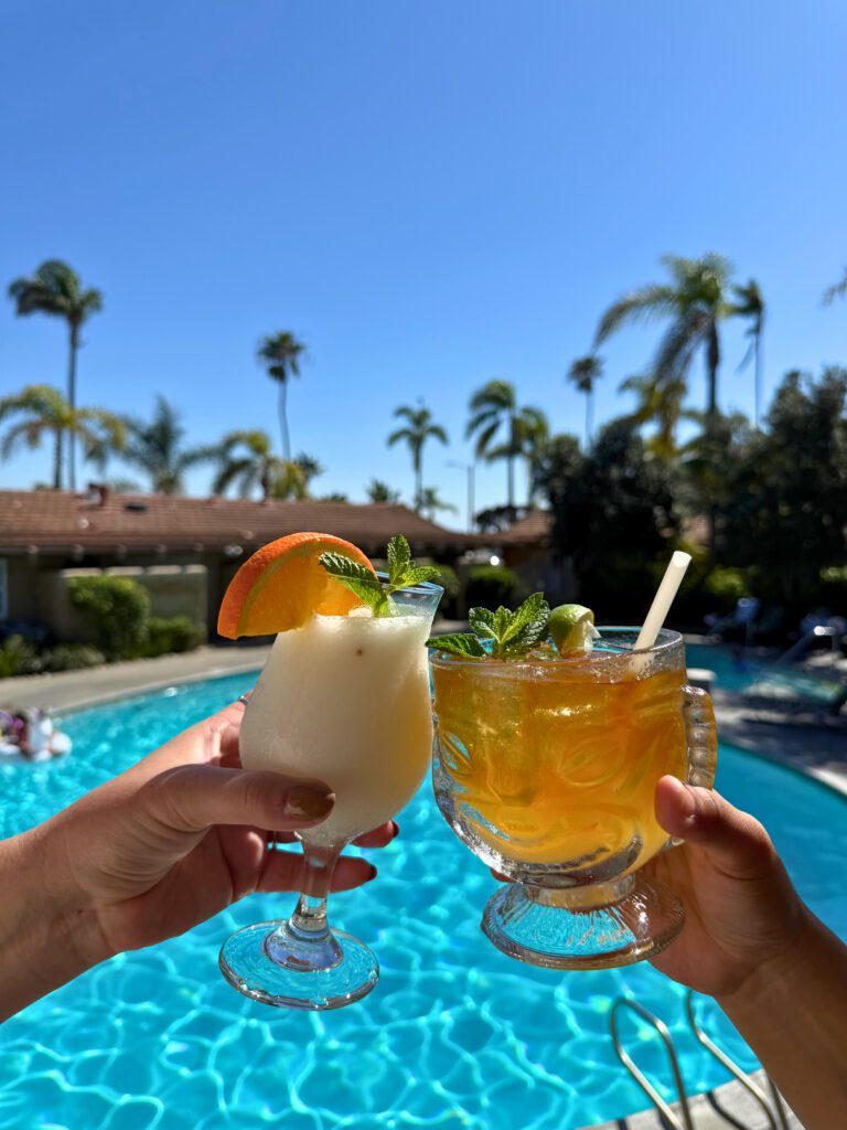 Two cocktails in front of pool