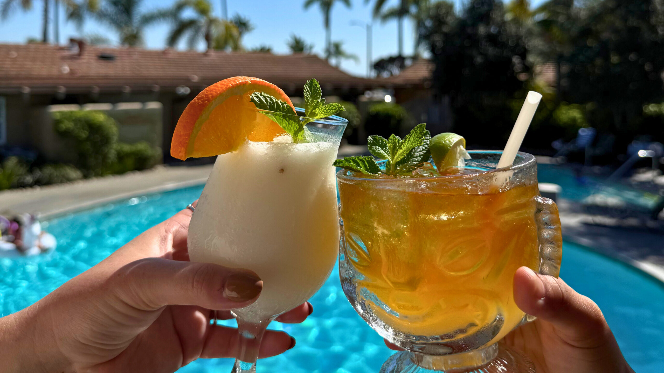 Two cocktails in front of pool