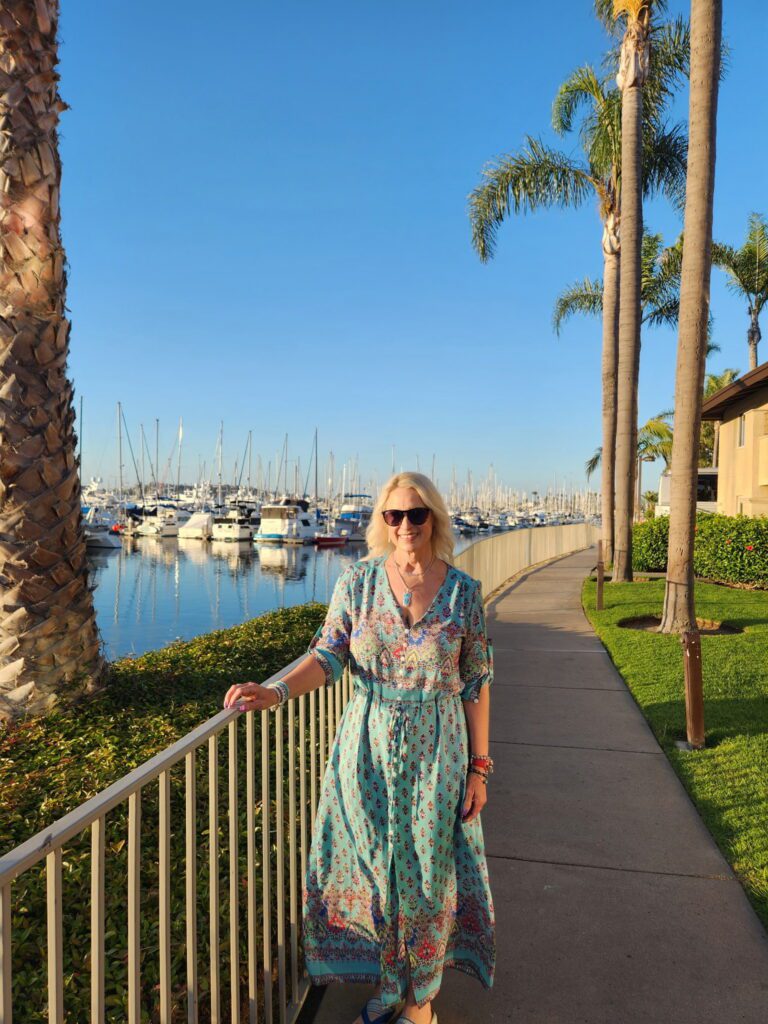 Woman standing in front of marina